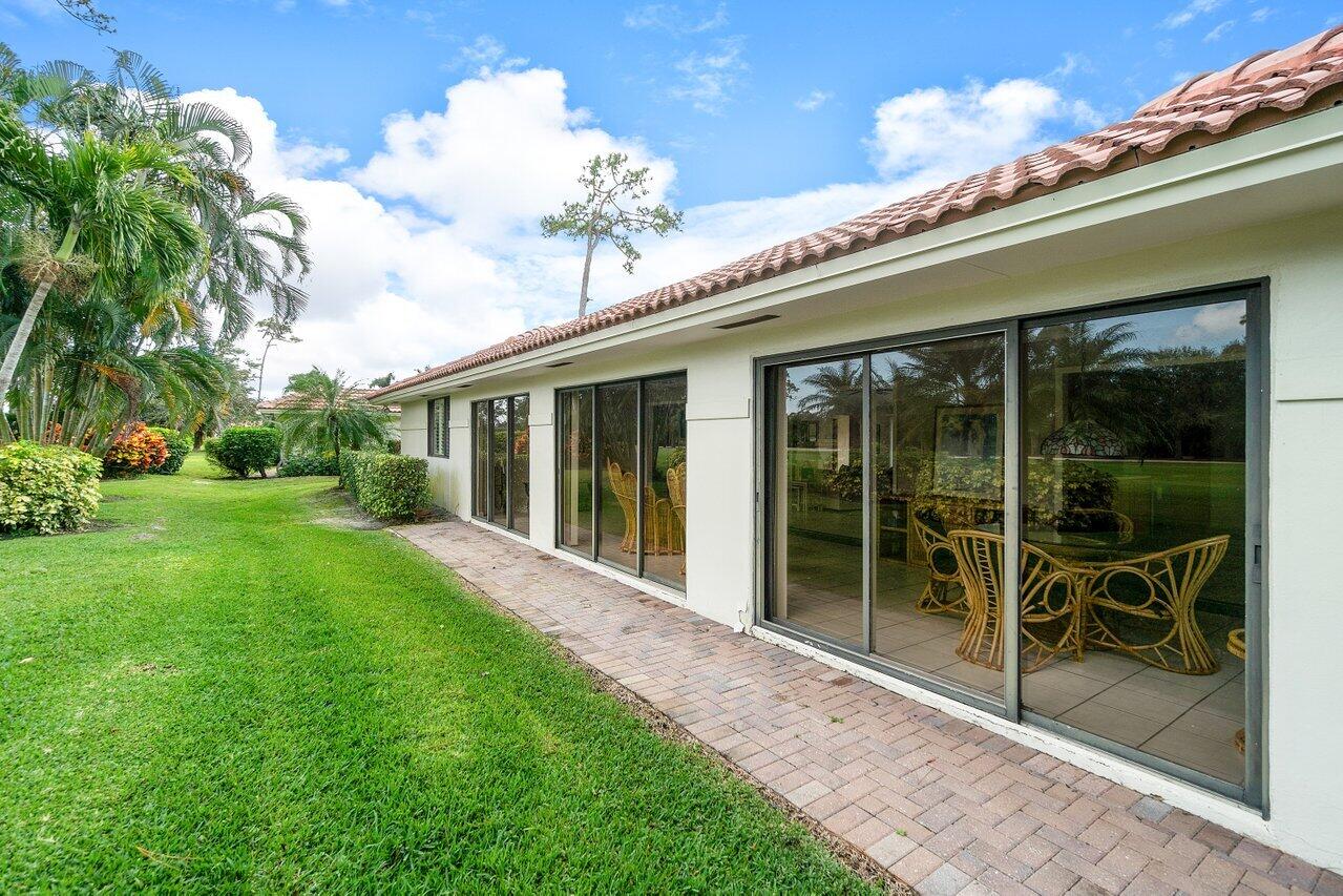 4022 Shell Drake Lane, Unit SHELLDRAKE Boynton Beach, FL 33436 - Photo 27 of 40 a view of a house with backyard porch and sitting area