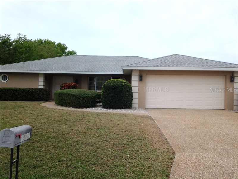 4542 Charing Cross Road Sarasota, FL 34241 - Photo 1 of 1 a front view of a house with a yard