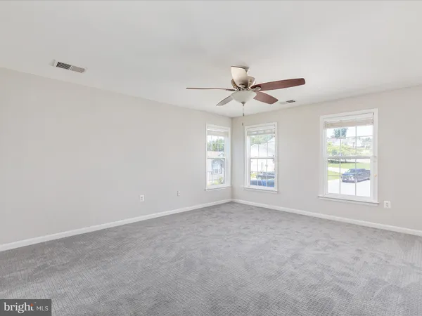 an empty room with closet area