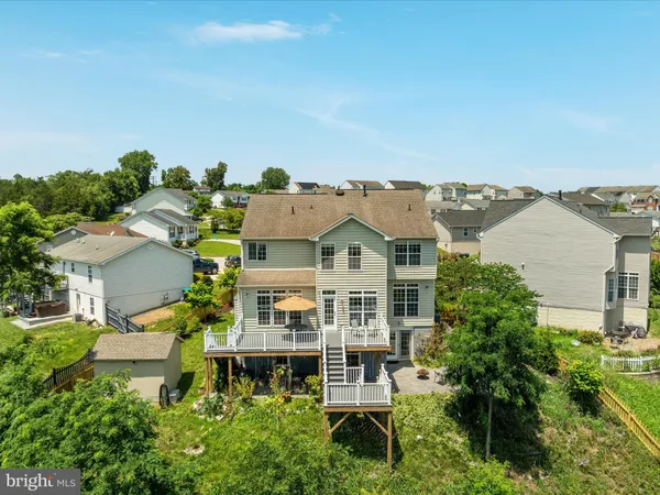 an aerial view of a house with a lake view