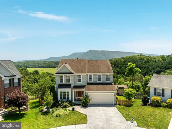 a aerial view of a house with a yard