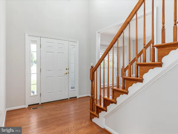a view of an entryway with wooden floor