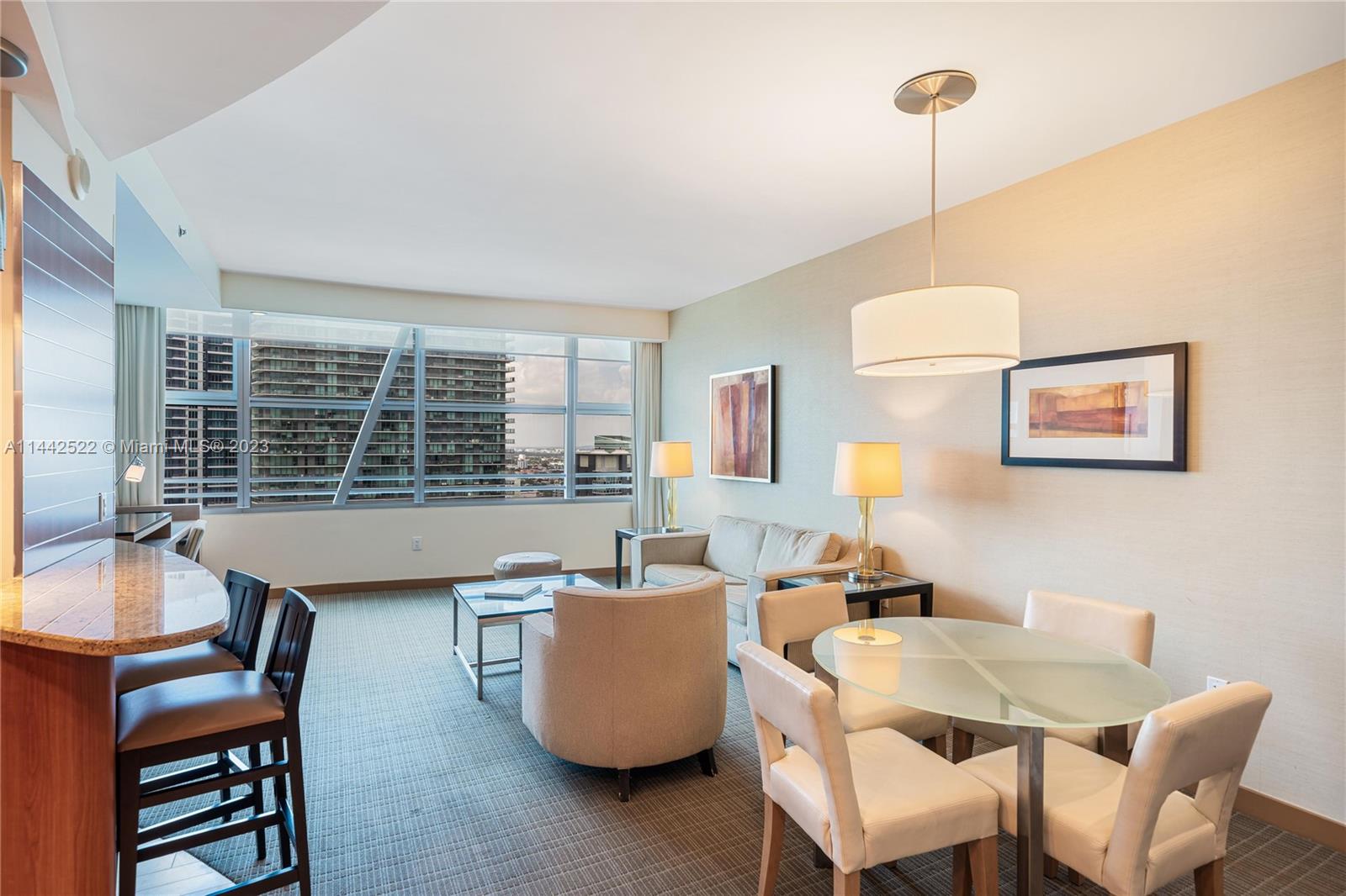 1395 Brickell Avenue, Unit 3205 Miami, FL 33131 - Photo 2 of 18 a view of a dining room with furniture window and outside view
