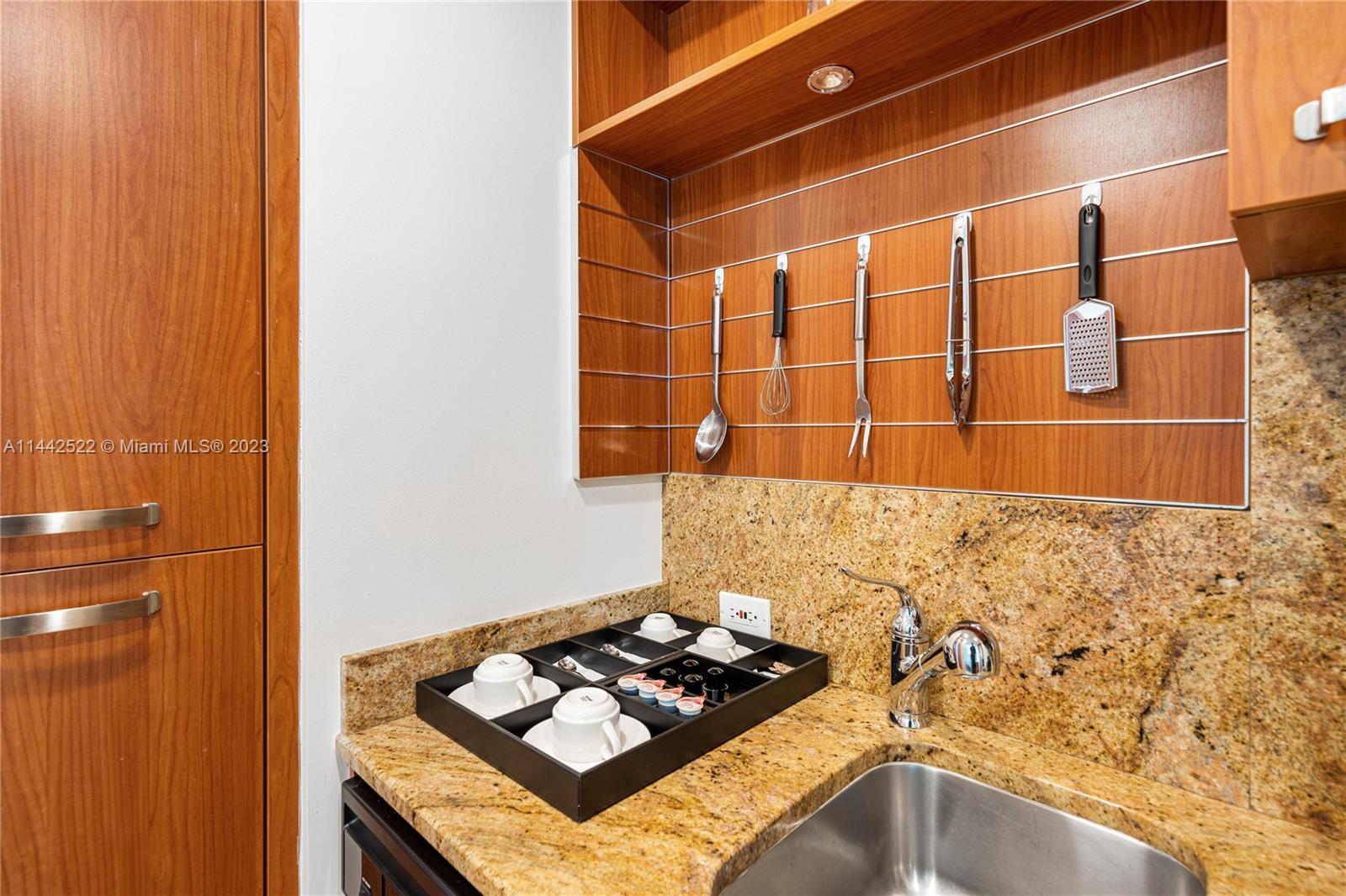 1395 Brickell Avenue, Unit 3205 Miami, FL 33131 - Photo 5 of 18 a bathroom with a sink and a mirror
