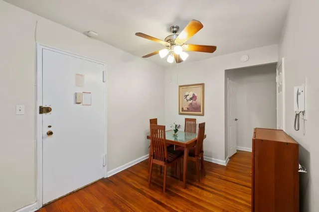 a view of a dining room with furniture and wooden floor