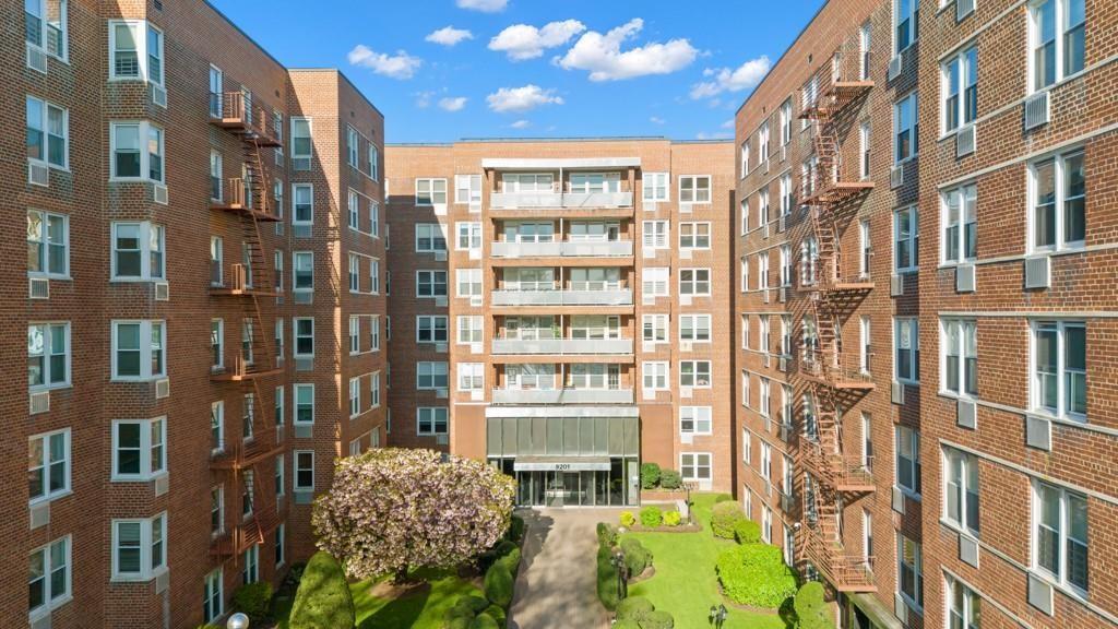 9201 Shore Road, Unit C403 Brooklyn, NY 11209 - Photo 6 of 16 a front view of a multi story building