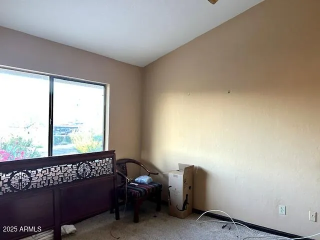 a view of a room with furniture and window