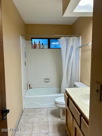 a bathroom with a sink a toilet and a bathtub