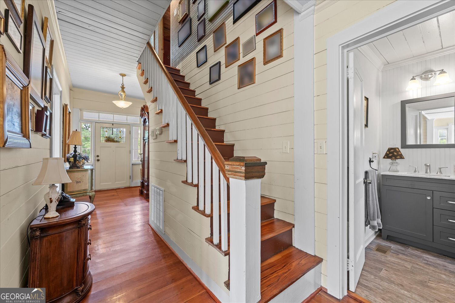 6644 East Cadley Road Norwood, GA 30821 - Photo 31 of 53 a view of a hallway with wooden floor and staircase