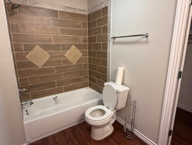 2410 Westcliff Road Killeen, TX 76543 - Photo 11 of 18 A well-appointed bathroom offers a convenient toilet and a bathtub with decorative tile surround.