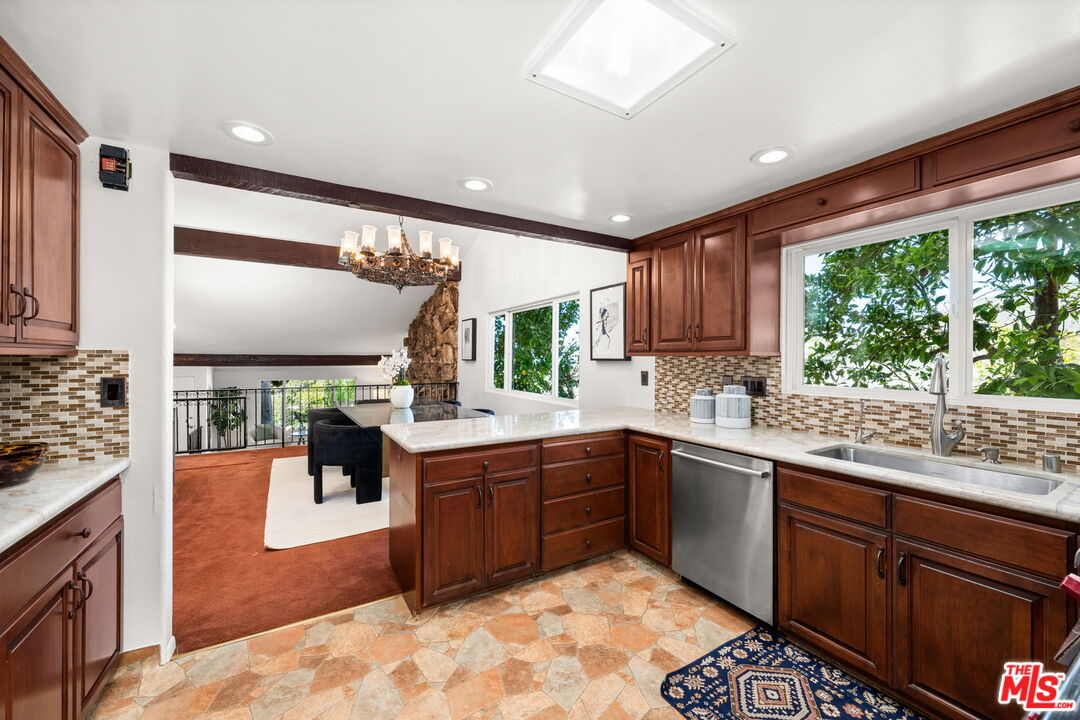 11080 Plainview Avenue Tujunga, CA 91042 - Photo 14 of 41 a kitchen with stainless steel appliances granite countertop sink stove and refrigerator