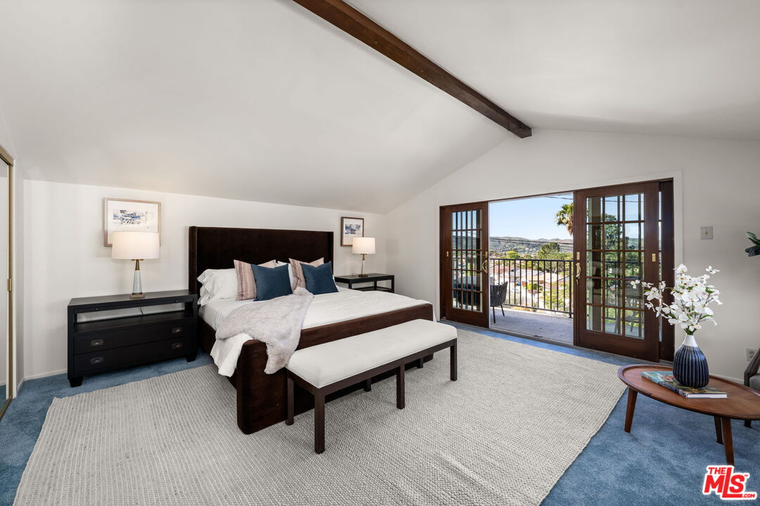 11080 Plainview Avenue Tujunga, CA 91042 - Photo 15 of 41 a spacious bedroom with a bed and wooden floor