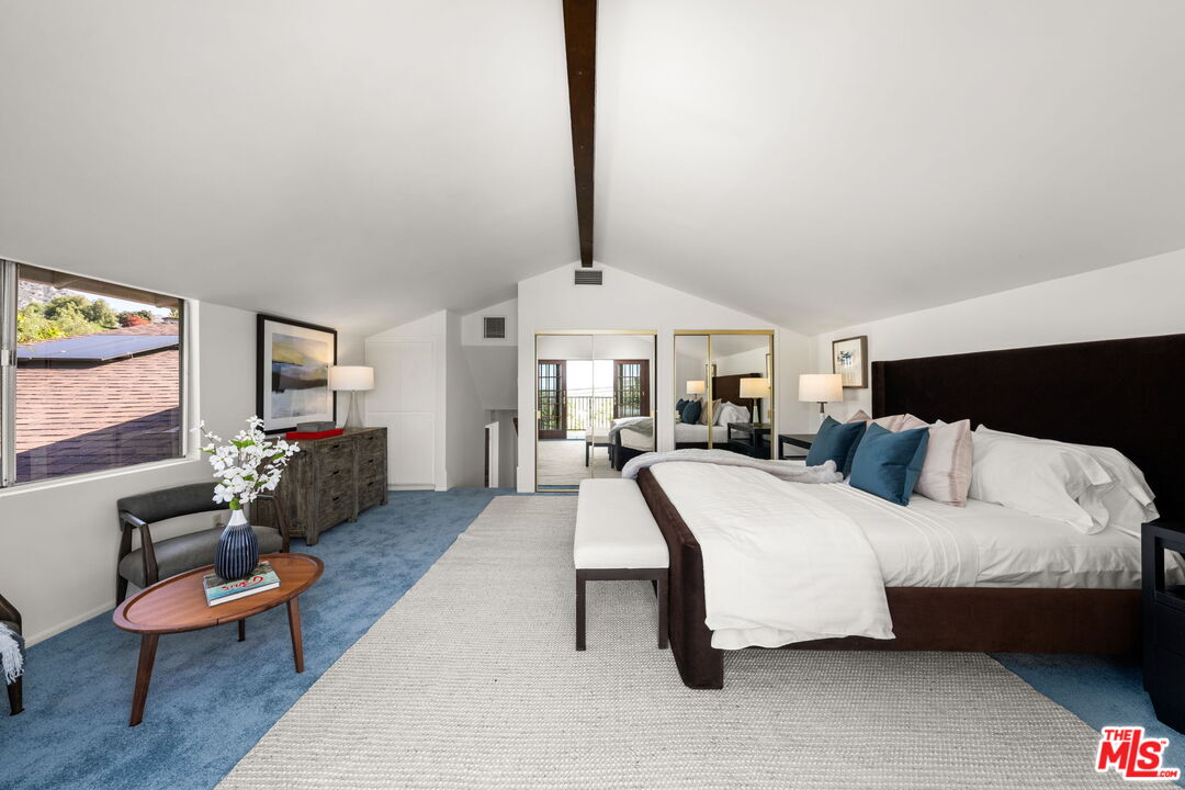 11080 Plainview Avenue Tujunga, CA 91042 - Photo 16 of 41 a spacious bedroom with a bed a couch and dresser