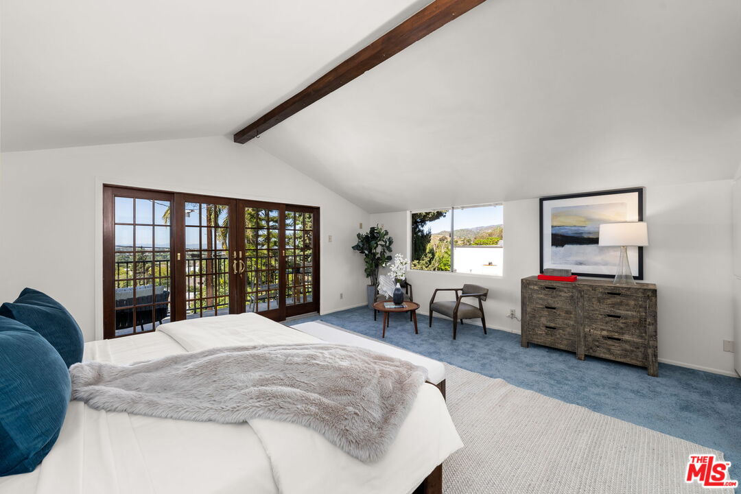 11080 Plainview Avenue Tujunga, CA 91042 - Photo 17 of 41 a spacious bedroom with a bed and wooden floor