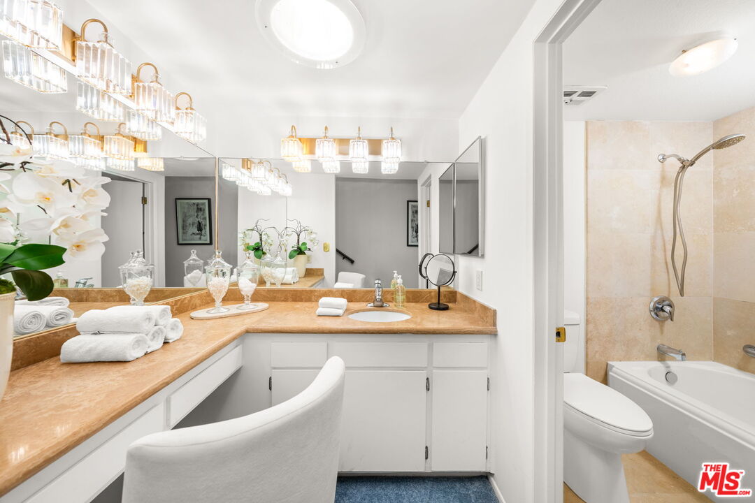 11080 Plainview Avenue Tujunga, CA 91042 - Photo 18 of 41 a bathroom with a granite countertop sink mirror and bathtub