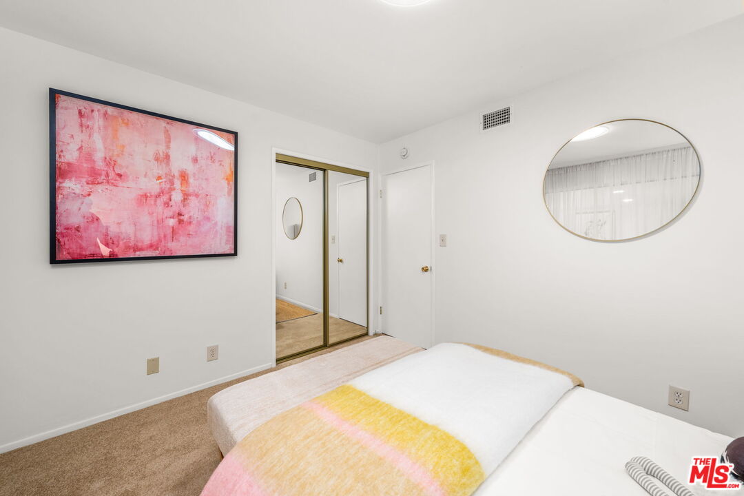 11080 Plainview Avenue Tujunga, CA 91042 - Photo 20 of 41 a bedroom with a bed and a painting on the wall