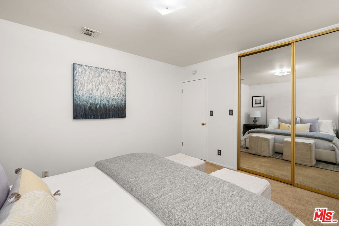 11080 Plainview Avenue Tujunga, CA 91042 - Photo 24 of 41 a bedroom with a bed and couch