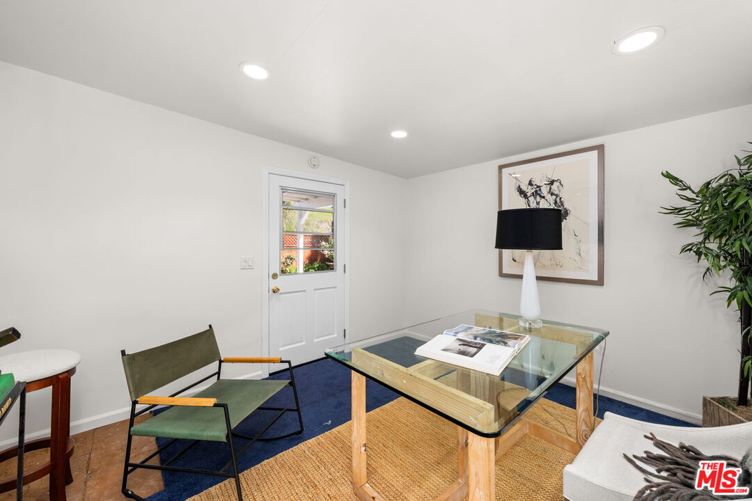 11080 Plainview Avenue Tujunga, CA 91042 - Photo 27 of 41 a living room with furniture and a flat screen tv