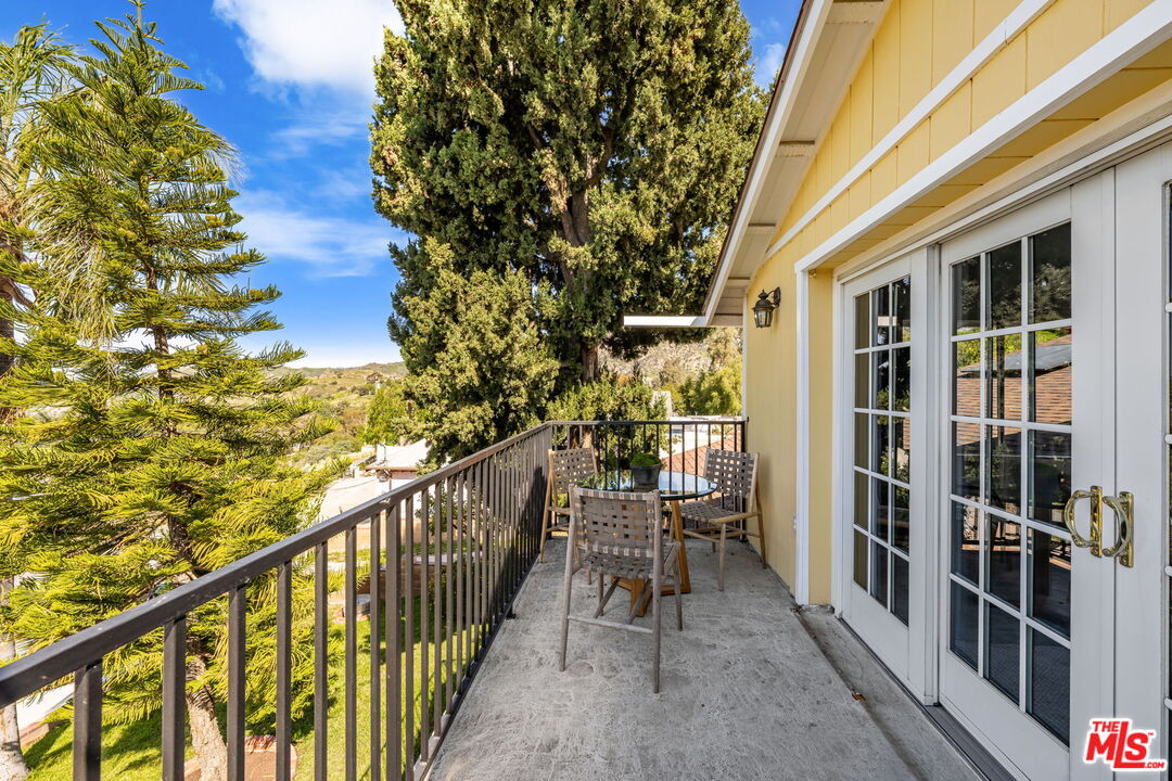 11080 Plainview Avenue Tujunga, CA 91042 - Photo 28 of 41 a view of balcony with wooden floor and fence