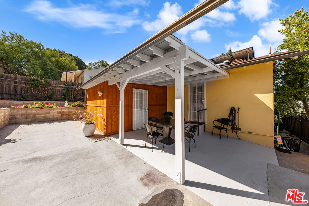 11080 Plainview Avenue Tujunga, CA 91042 - Photo 30 of 41 a view of a porch with furniture and a patio