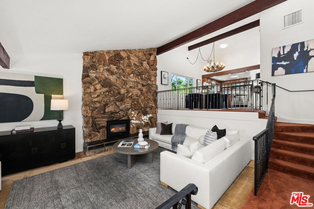 11080 Plainview Avenue Tujunga, CA 91042 - Photo 3 of 41 a living room with furniture and a fireplace