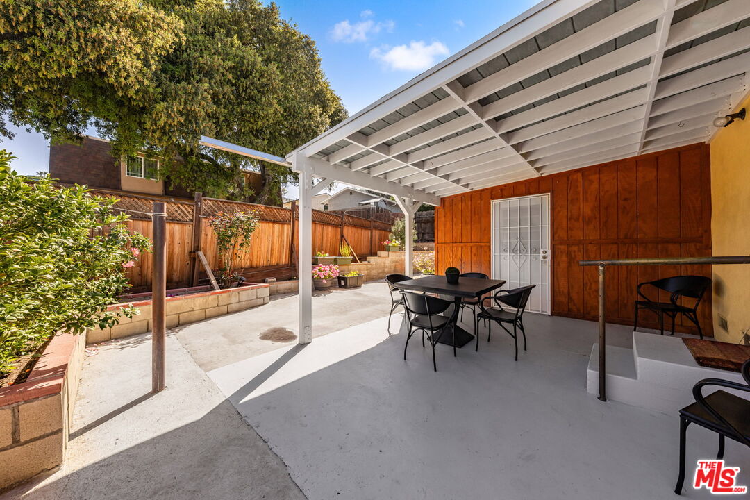 11080 Plainview Avenue Tujunga, CA 91042 - Photo 31 of 41 a dining space with furniture and a potted plant