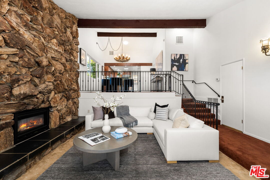 11080 Plainview Avenue Tujunga, CA 91042 - Photo 4 of 41 a living room with furniture and a fireplace