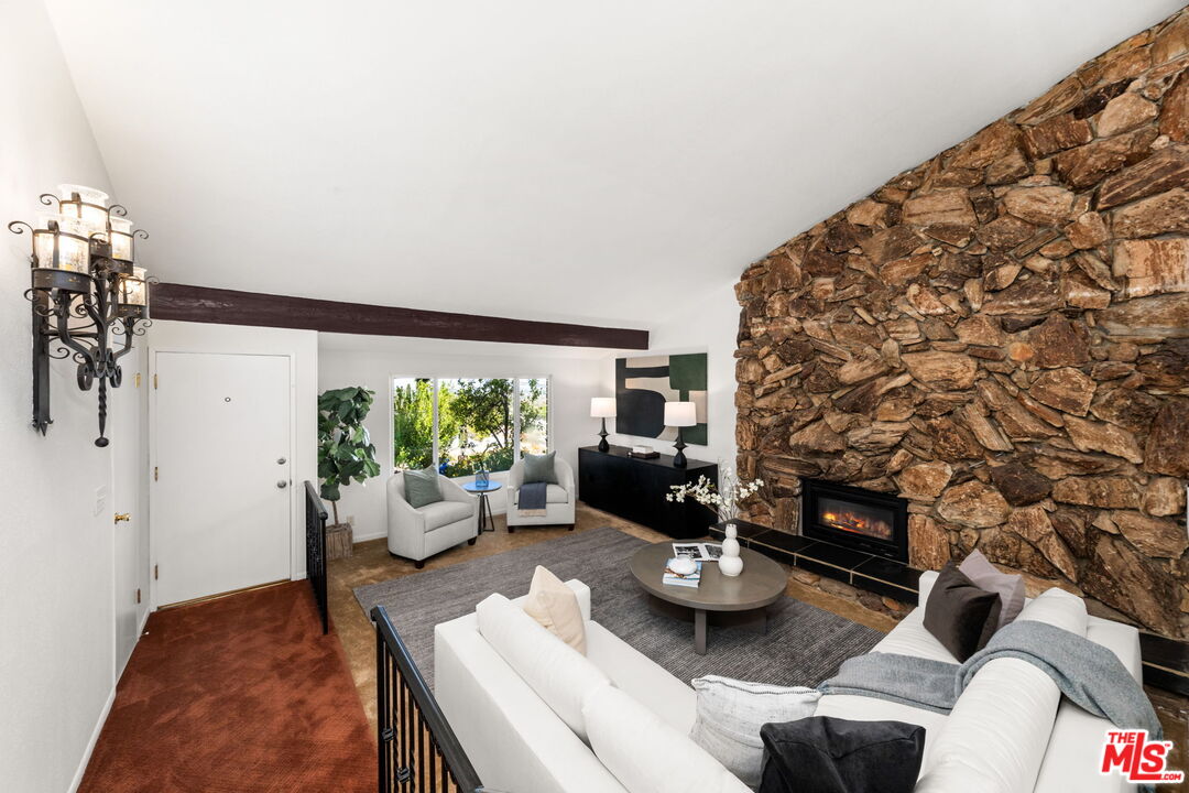 11080 Plainview Avenue Tujunga, CA 91042 - Photo 6 of 41 a living room with furniture and a floor to ceiling window