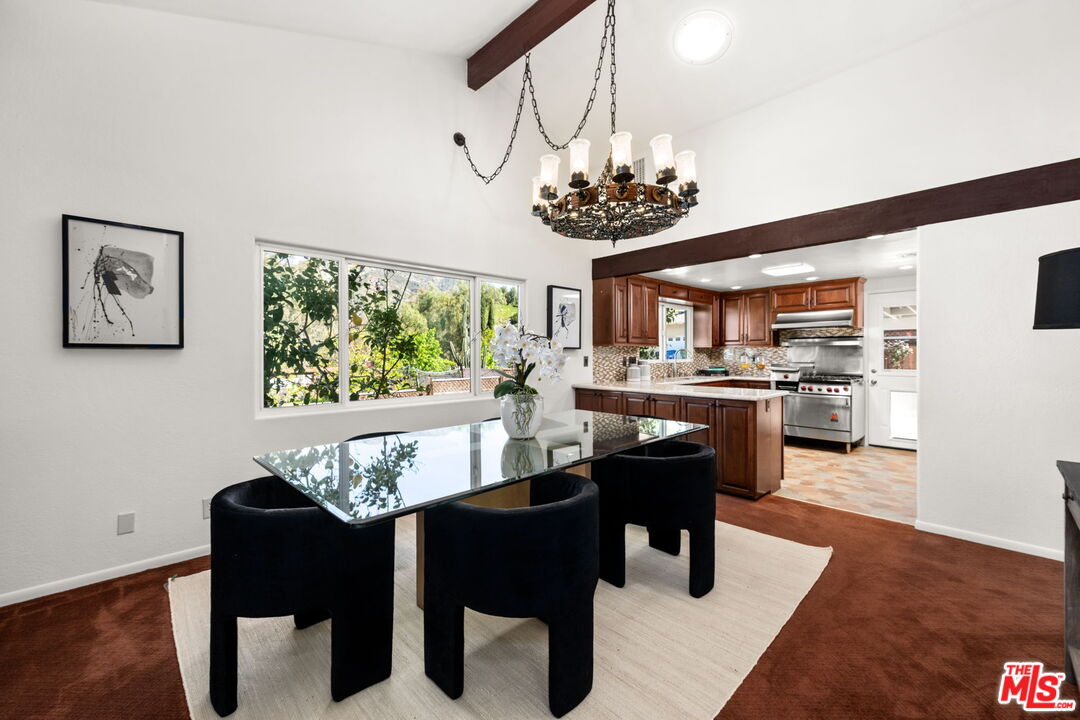 11080 Plainview Avenue Tujunga, CA 91042 - Photo 7 of 41 a dining room with furniture a chandelier and wooden floor