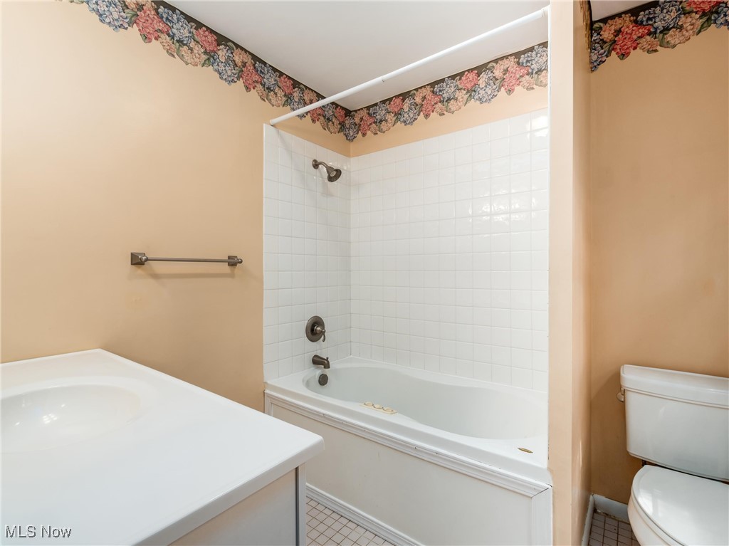 975 Richey Road Zanesville, OH 43701 - Photo 18 of 27 Full bath with toilet, vanity, shower / bathtub combination, and tile patterned flooring