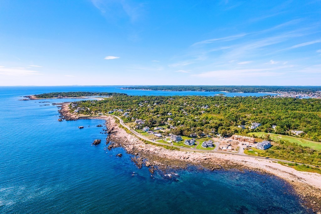 163 Atlantic Road, Unit 8 Gloucester, MA 01930 - Photo 1 of 21 a view of a lake with a big yard