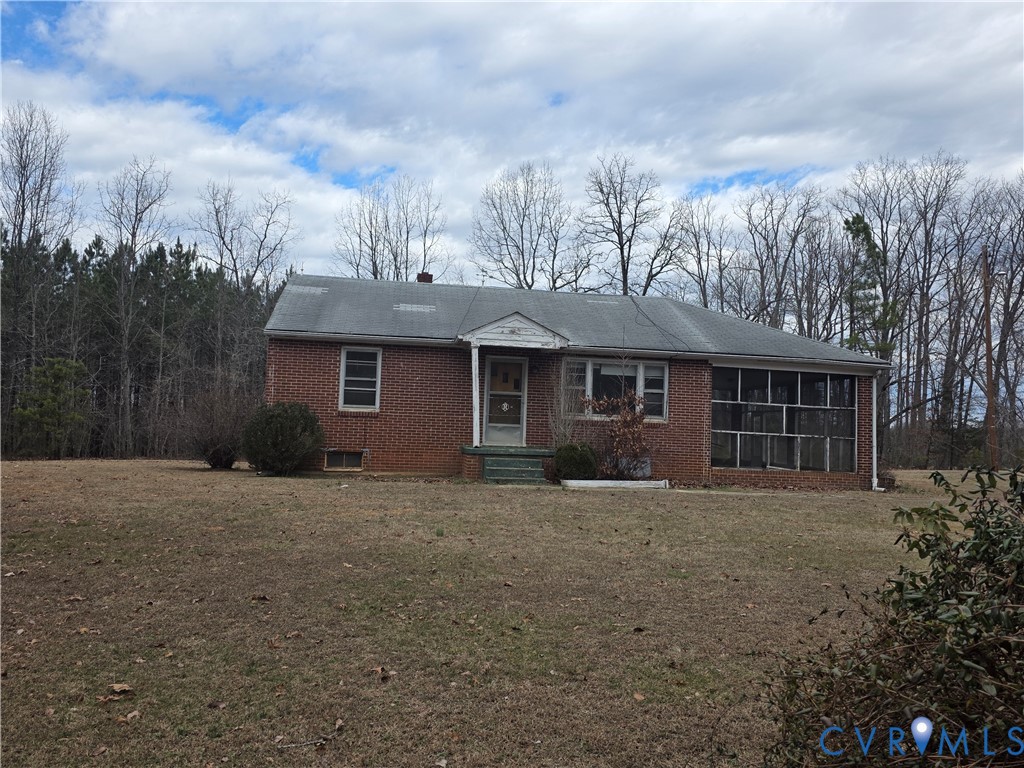1429 Taro Road Cullen, VA 23934 - Photo 3 of 23 a front view of a house with a garden
