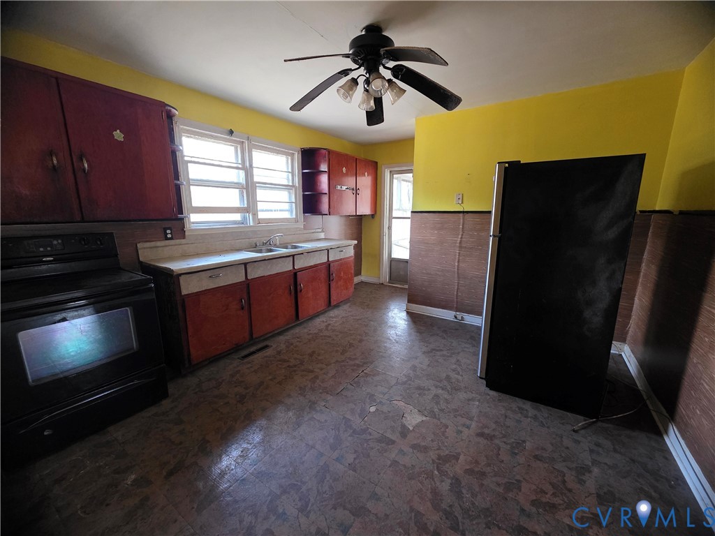 1429 Taro Road Cullen, VA 23934 - Photo 5 of 23 a kitchen with stainless steel appliances granite countertop a refrigerator a sink a stove and dishwasher