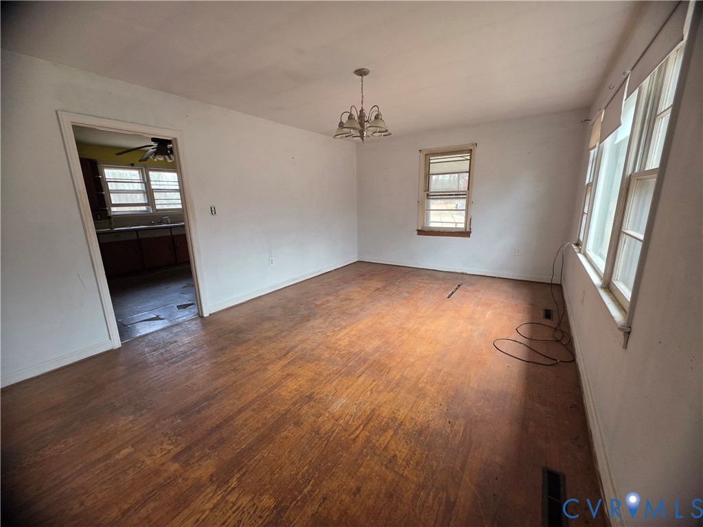 1429 Taro Road Cullen, VA 23934 - Photo 7 of 23 wooden floor in an empty room with a window
