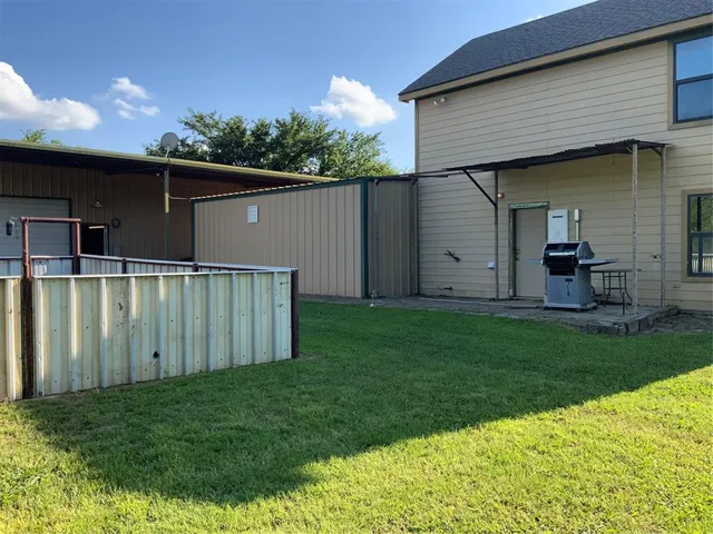 a backyard of a house with lots of green space