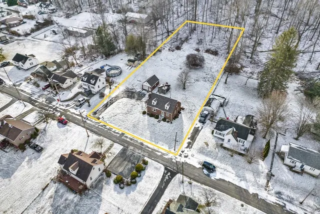 an aerial view of a house with roof deck