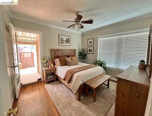 a bedroom with a large bed and a window