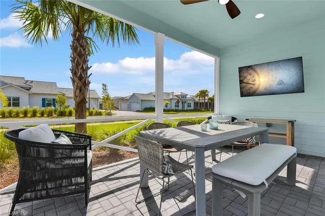 a view of a swimming pool with seating area