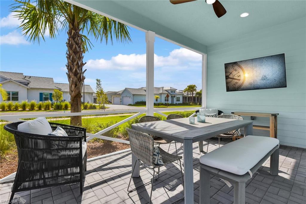 7110 Cayo Coco Lane Naples, FL 34113 - Photo 2 of 45 a view of a swimming pool with seating area
