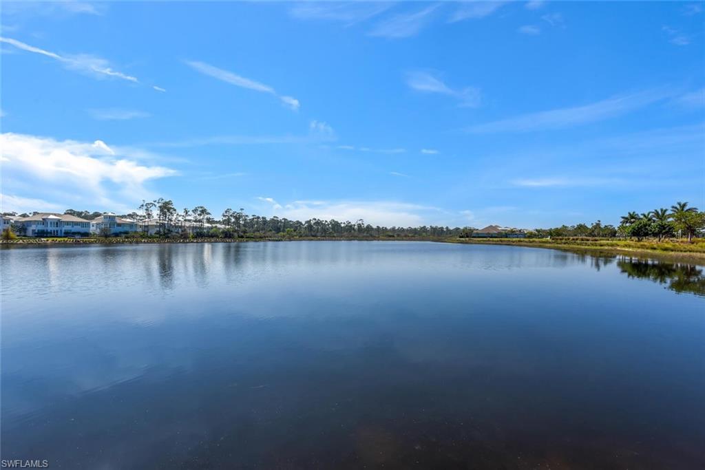7110 Cayo Coco Lane Naples, FL 34113 - Photo 43 of 45 a view of a lake with houses in the back