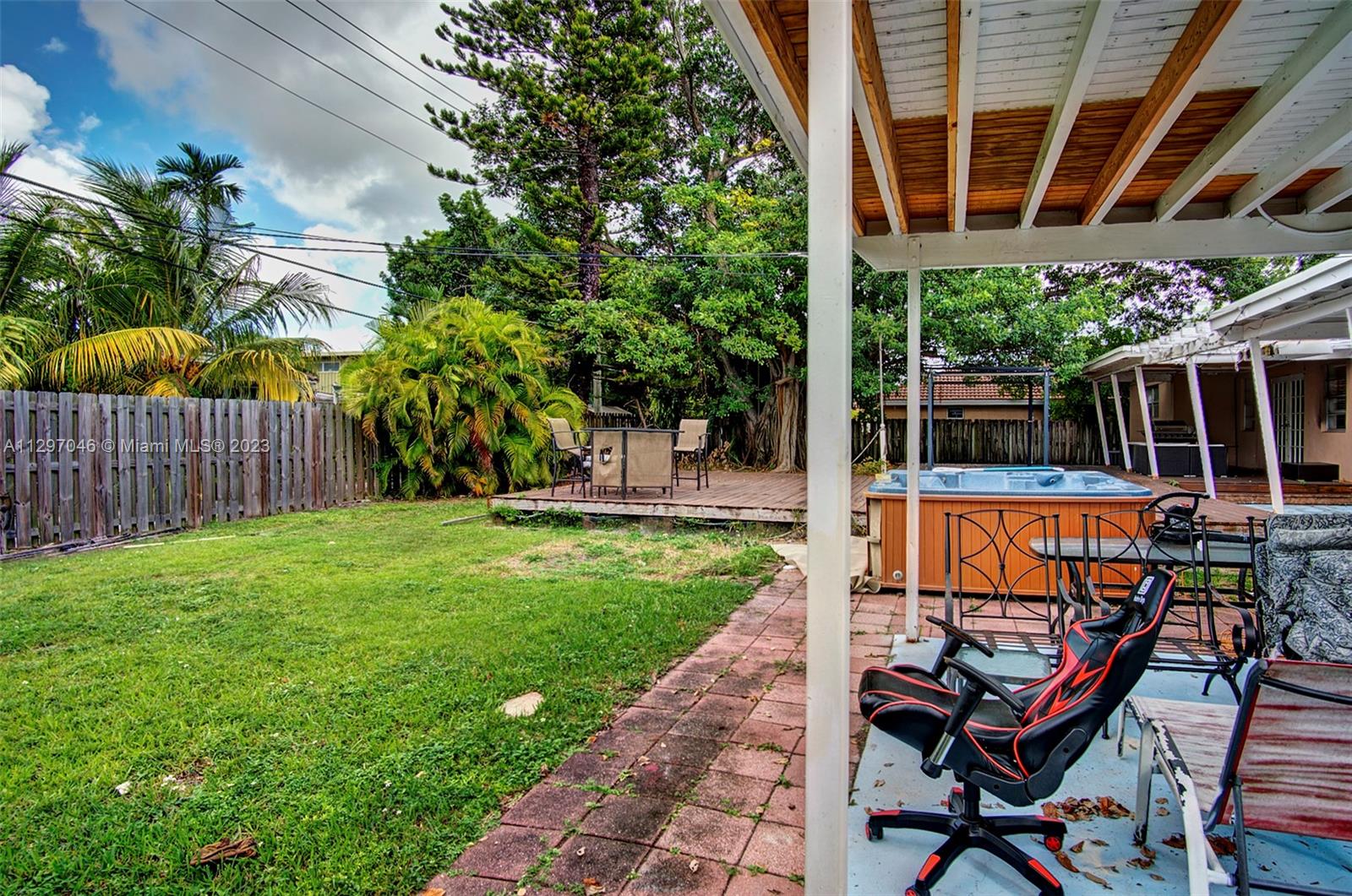 3457 Fillmore Street Hollywood, FL 33021 - Photo 14 of 18 a view of a backyard with sitting area