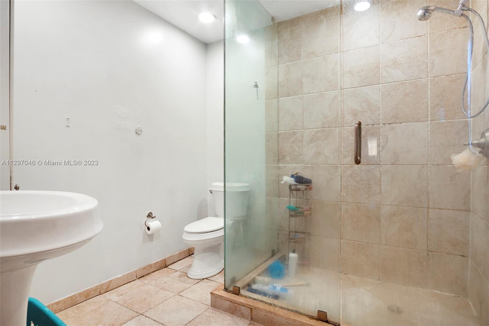 3457 Fillmore Street Hollywood, FL 33021 - Photo 10 of 18 a bathroom with a toilet a sink and shower
