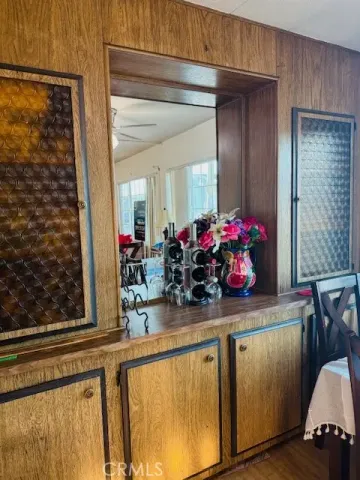 a kitchen with a sink and a mirror