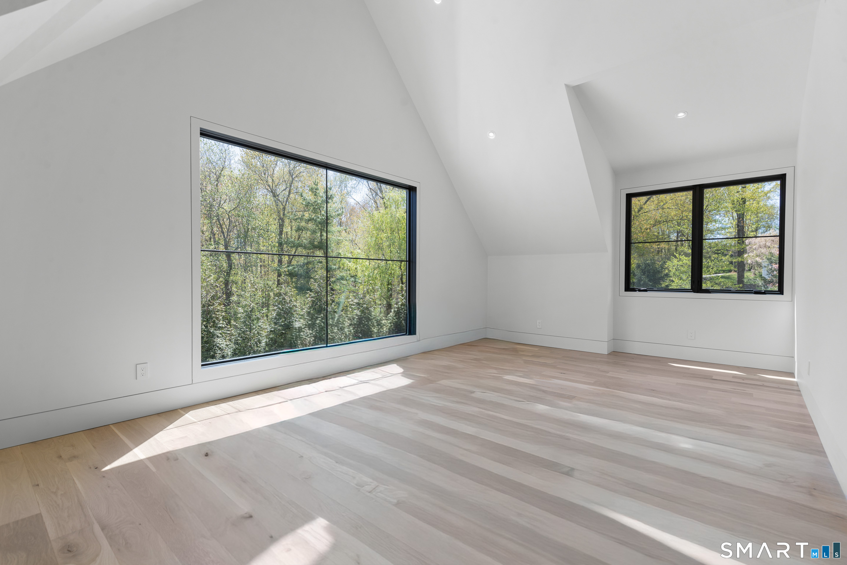 259 Frogtown Road New Canaan, CT 06840 - Photo 30 of 39 an empty room with wooden floor and windows