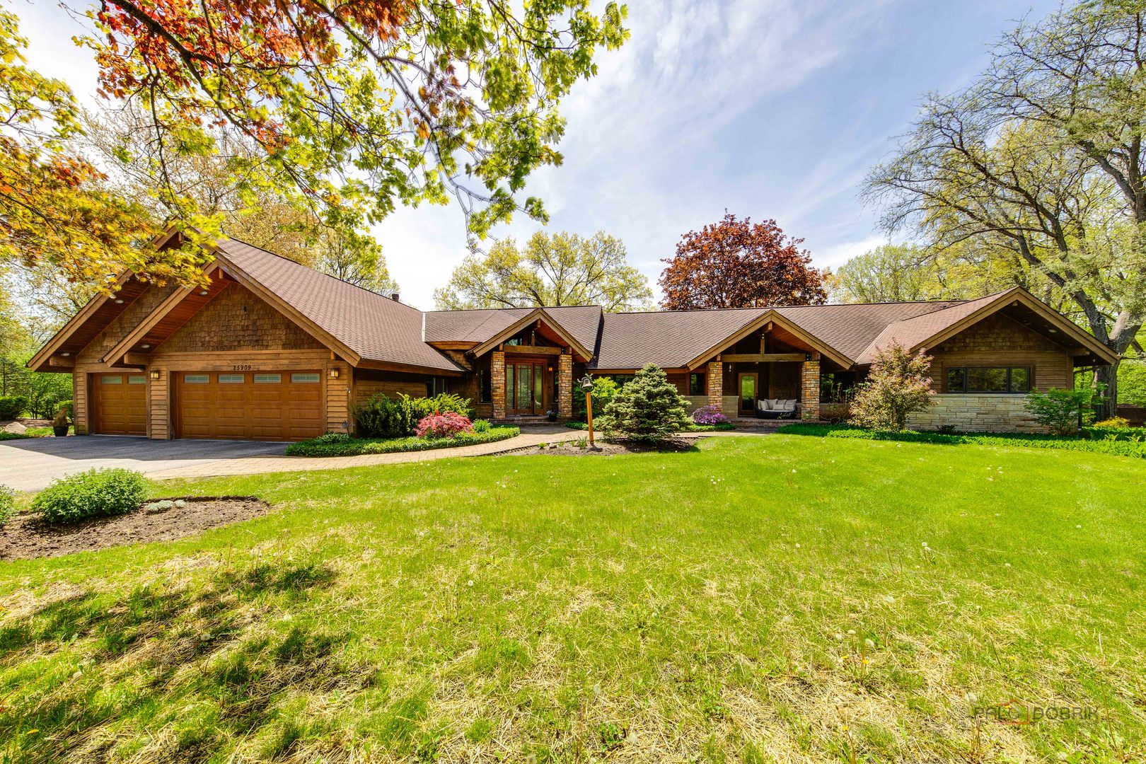 25909 West Sunset Road Barrington, IL 60010 - Photo 1 of 50 a wooden house with pool in front of it