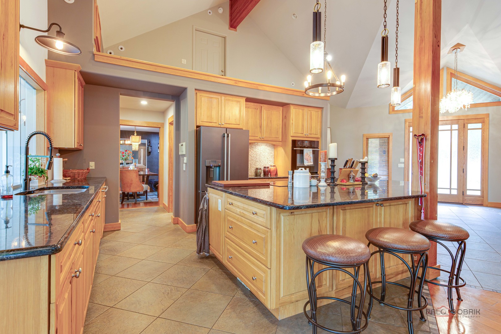 25909 West Sunset Road Barrington, IL 60010 - Photo 11 of 50 a large kitchen with a table and chairs