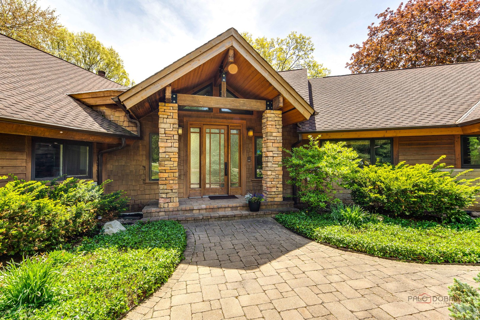 25909 West Sunset Road Barrington, IL 60010 - Photo 3 of 50 a front view of a house with garden