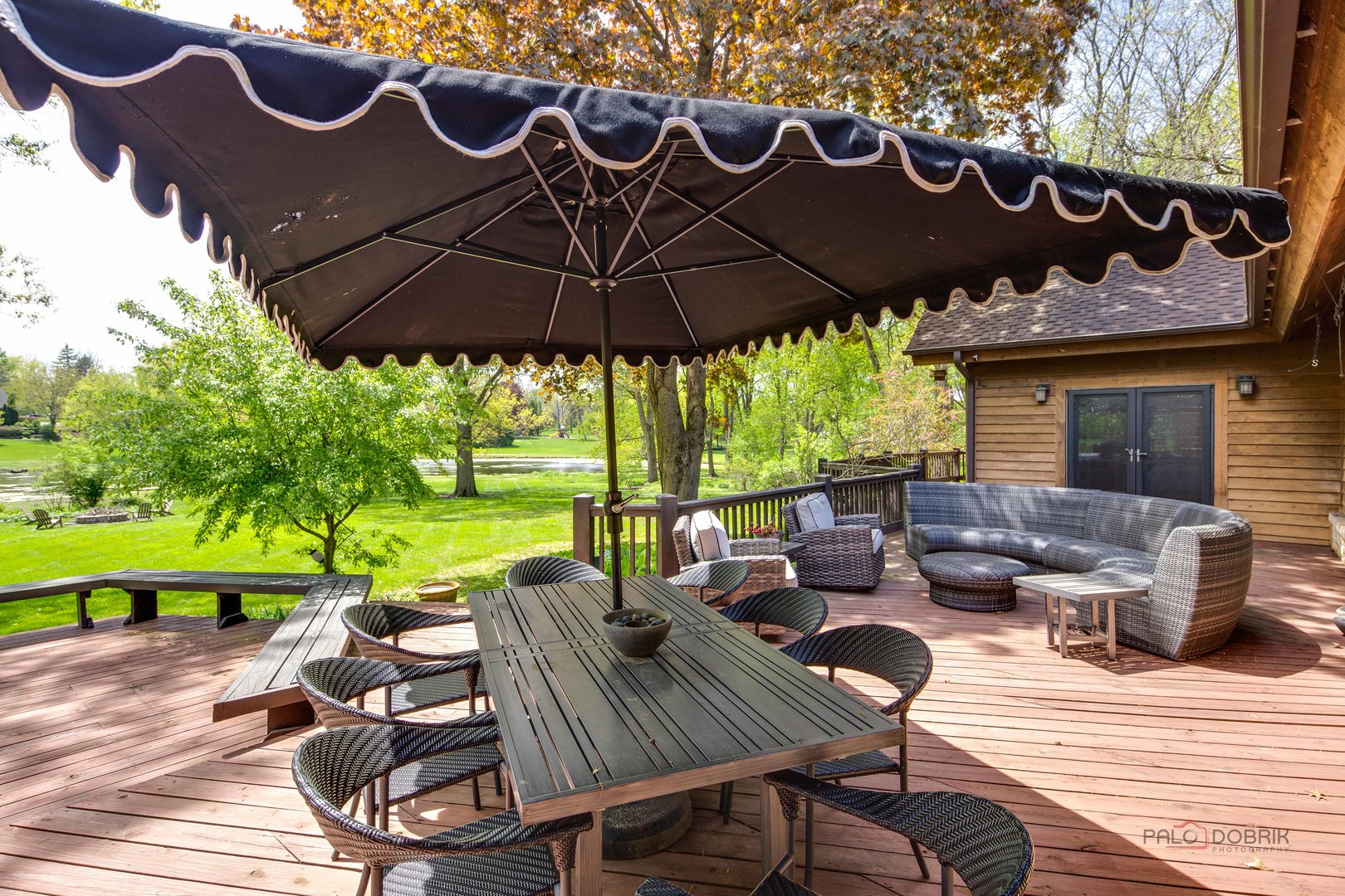 25909 West Sunset Road Barrington, IL 60010 - Photo 47 of 50 a view of a patio with table and chairs potted plants with a garden
