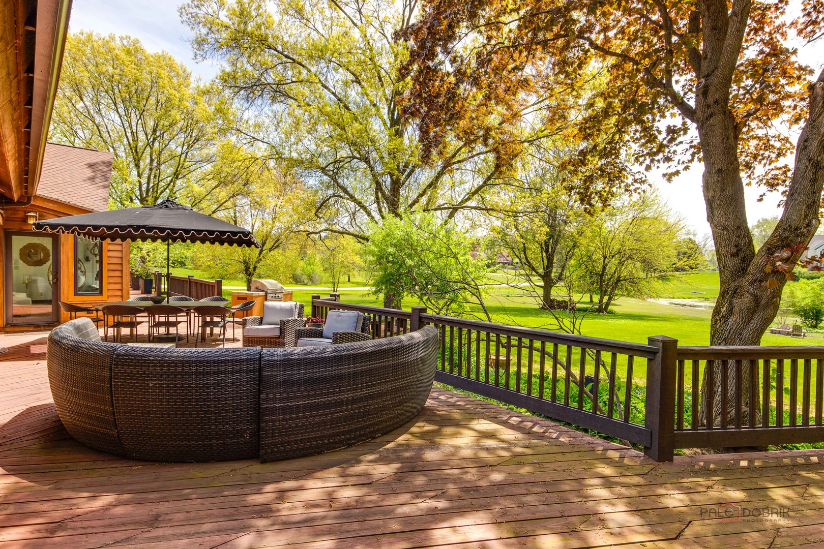 25909 West Sunset Road Barrington, IL 60010 - Photo 48 of 50 a view of a couches and table under an umbrella
