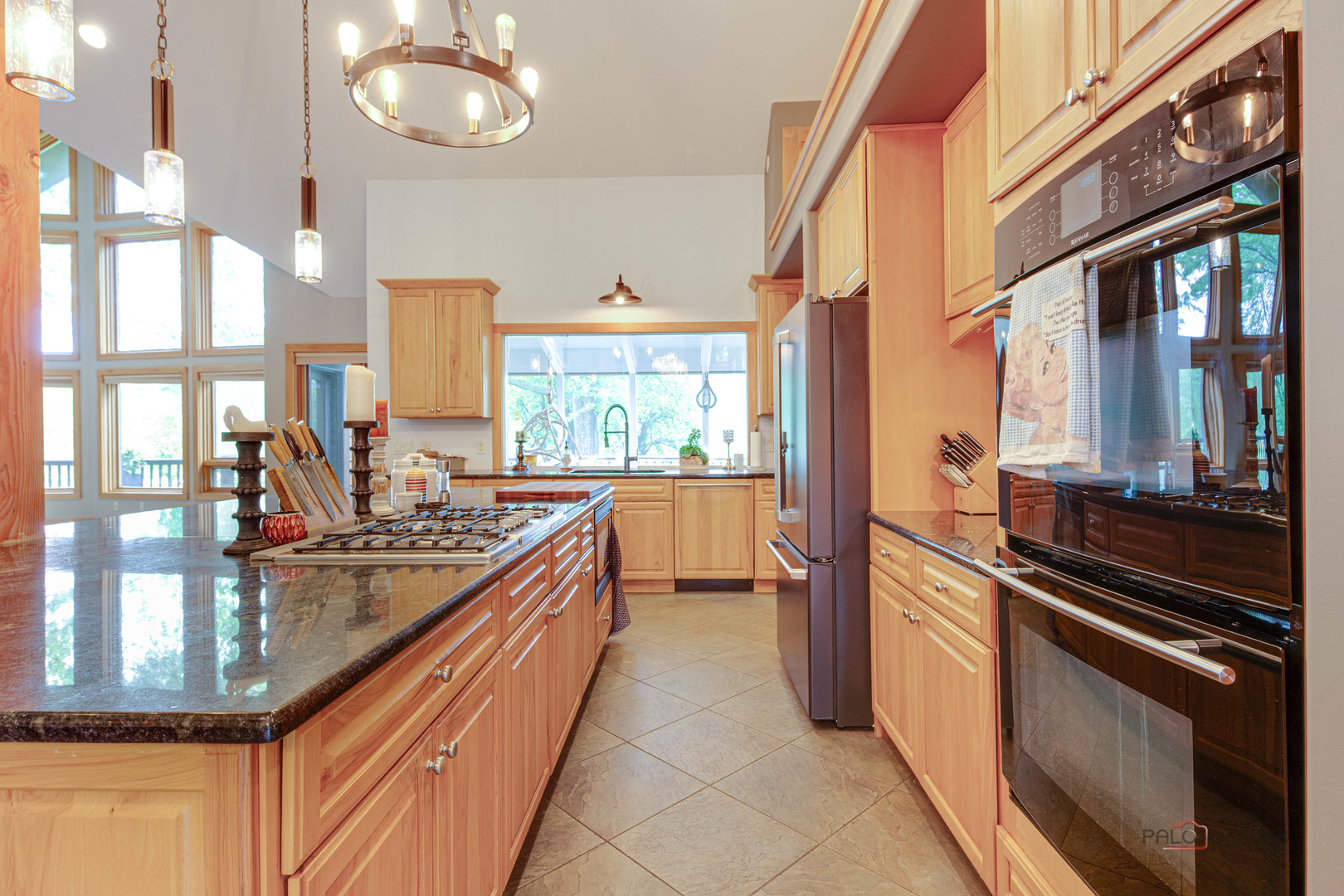 25909 West Sunset Road Barrington, IL 60010 - Photo 7 of 50 a kitchen with lots of counter top space and wooden floor